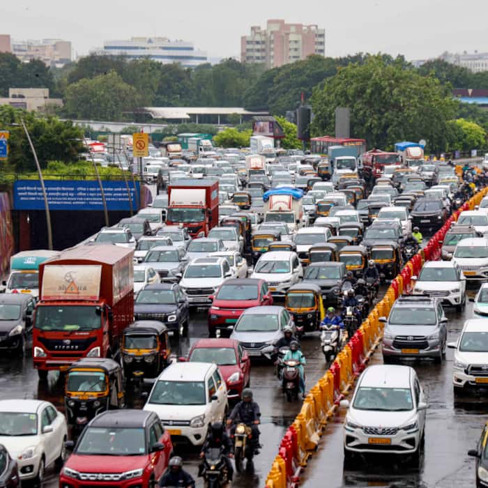 Vehicles move through heavy traffic on the Western Express Highway following rains, in Mumbai