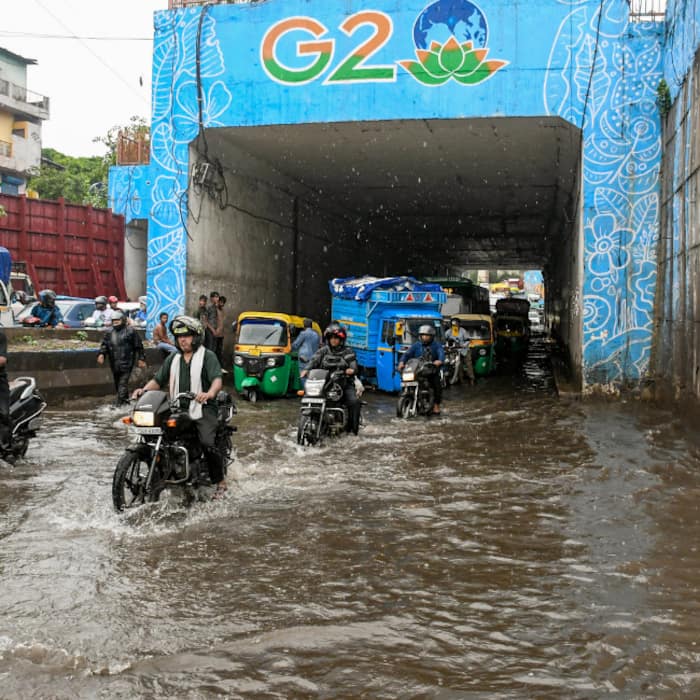 Vehicles ply on a waterlogged underpass after heavy rain, near Kishanganj railway, Bihar
