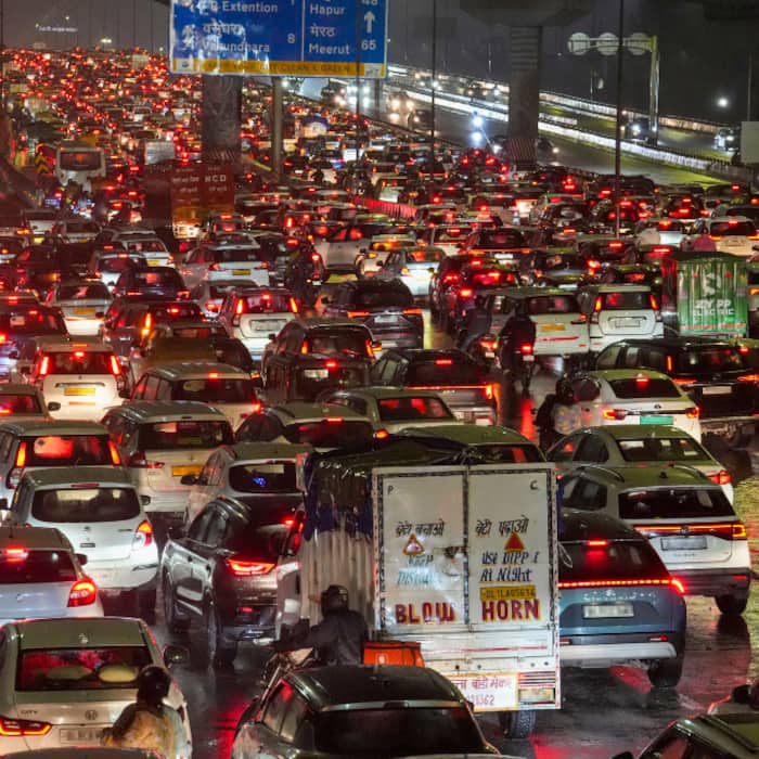 Vehicles stuck in traffic following rainfall, in New Delhi