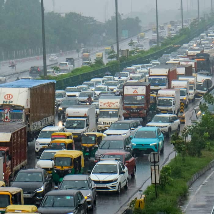 Vehicles stuck in traffic on the Delhi-Gurugram Expressway amid rain, in Gurugram, Haryana